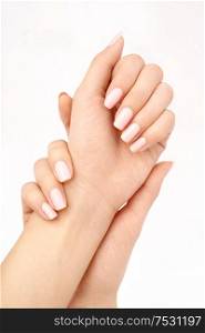 Two beautiful female hands with manicure, isolated