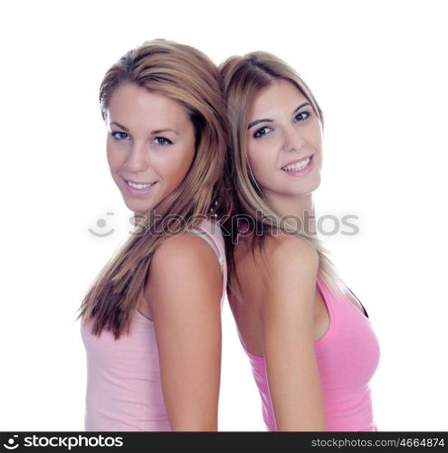 Two beautiful girl friends in pink isolated on a white background