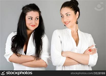 Two beautiful girls in white blouses