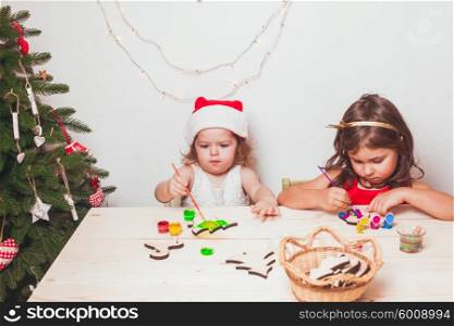 Two beautiful girls painted wooden Christmas figurines. Handmade Christmas decorations