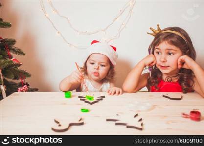 Two beautiful girls painted wooden Christmas figurines. Handmade Christmas decorations