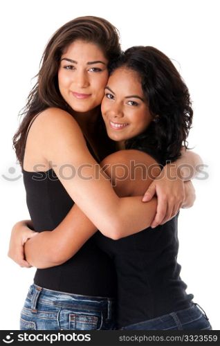 Two beautiful happy smiling young adult women hugging as best friends, isolated.