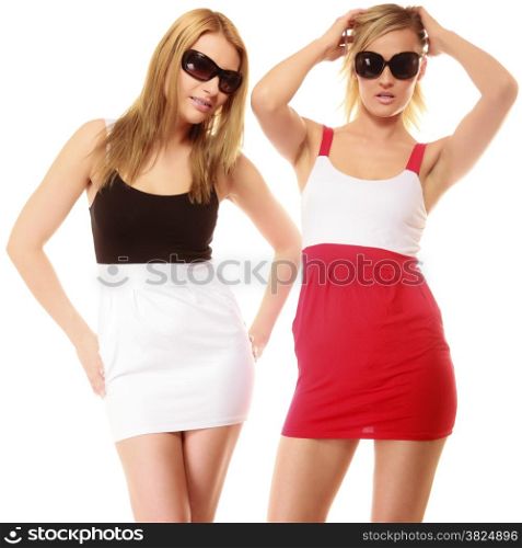 two beautiful sexy crazy women fashion girls in summer clothes sunglasses. Studio portrait isolated on white