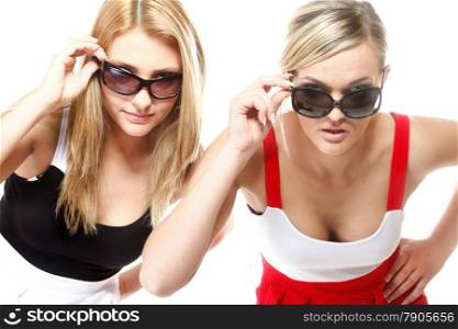 Two beautiful sexy crazy women in summer clothes and sunglasses. Studio shot isolated on white background