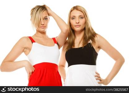 two beautiful sexy fashion women in summer clothes. Studio shot isolated on white.