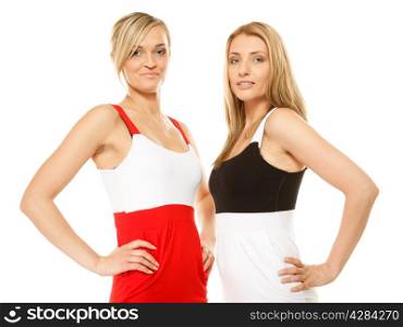two beautiful sexy fashion women in summer clothes. Studio shot isolated on white.