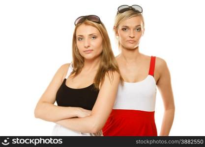 two beautiful women fashion girls in summer clothes sunglasses. Studio portrait isolated on white