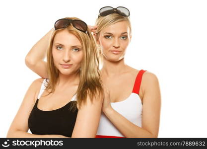 two beautiful women fashion girls in summer clothes sunglasses. Studio portrait isolated on white