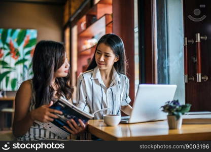 Two beautiful women talking everything together at coffee shop cafe