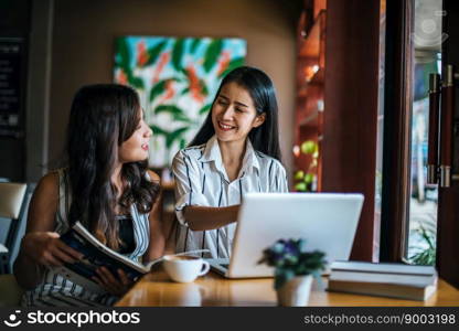 Two beautiful women talking everything together at coffee shop cafe