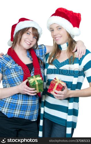 Two beautiful young women exchanging Christmas presents