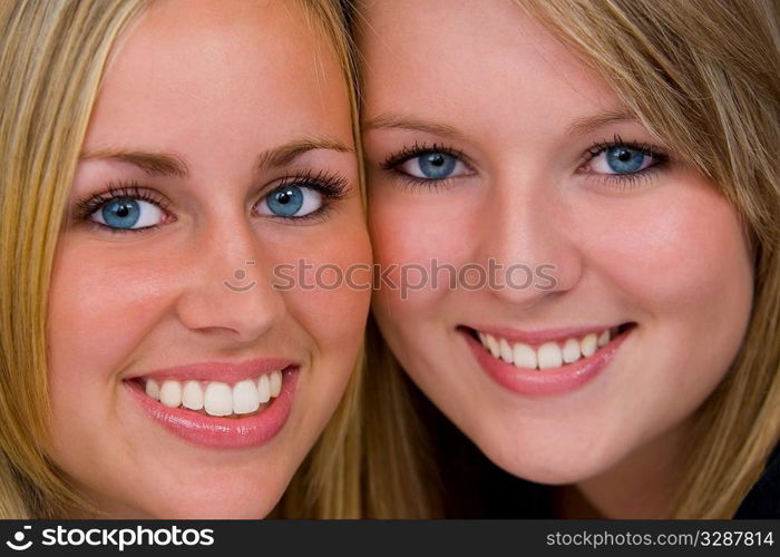 Two beautiful young women in close up