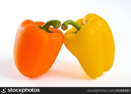 Two bell peppers leaning close together
