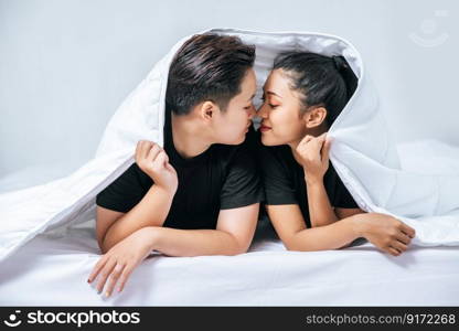 Two beloved young women slept in bed together.