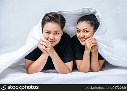 Two beloved young women slept in bed together.