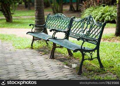 Two bench seats. Adjacent to the corridor within the park. To rest in the garden.