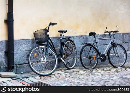 two bicycles on a city street