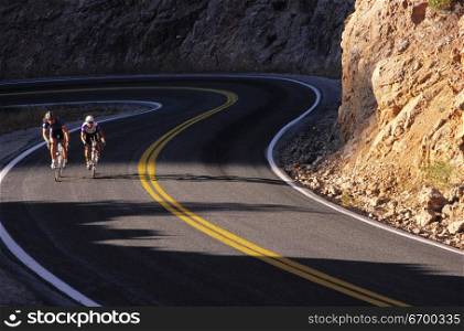 Two bikers on a country road