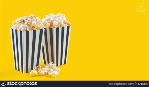 Two black white striped carton buckets with tasty cheese popcorn, isolated on yellow background. Box with scattering of popcorn grains. Fast food, movies, cinema and entertainment concept.