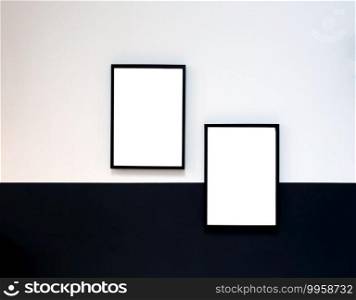 Two blank Poster,canvas,frame hanging on black and white wall, interior design modern mock up frames copy space,