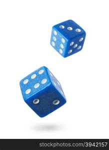 Two blue gambling dices falling down isolated on white .Local focus