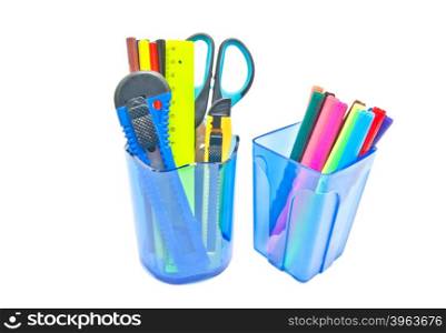 two blue glasses with office supplies on white background
