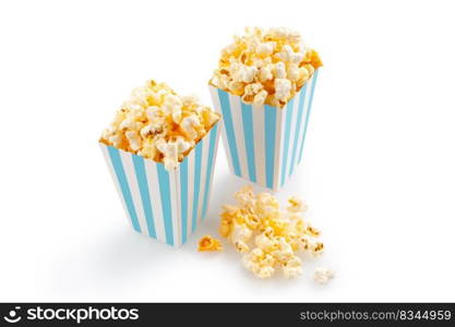Two blue white striped carton buckets with tasty cheese popcorn, isolated on white background. Movies, cinema and entertainment concept.