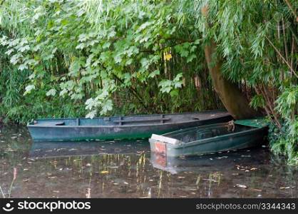 Two boats in Monet&rsquo;s garden pond