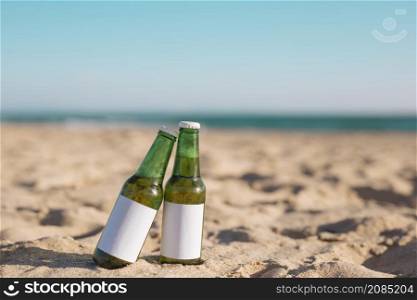 two bottles beer sandy beach
