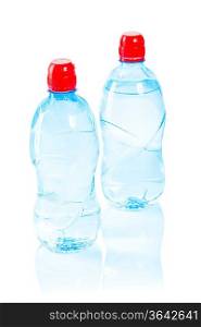 two bottles with water isolated on white