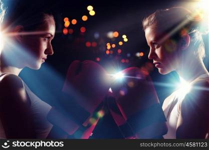 Two boxer women. Two boxer women in gloves greet each other before fight