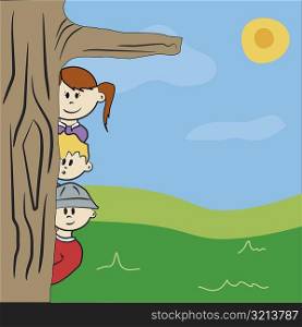 Two boys and a girl peeking from behind a tree