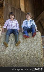 Two boys on haybale