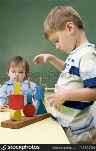 Two boys playing with toys