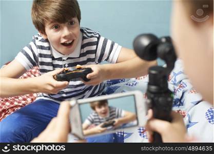 Two Boys Recording Gaming Blog In Bedroom