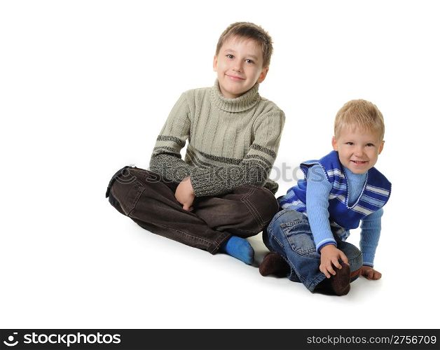 Two brothers. Age of 3 and 7 years. It is isolated on a white background