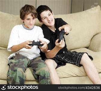 Two brothers at home playing video games together.