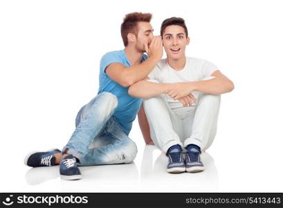 Two brothers whispering isolated on a white background