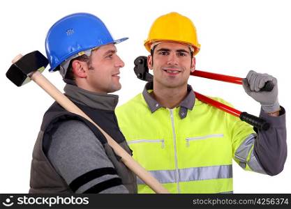 Two builders with tools