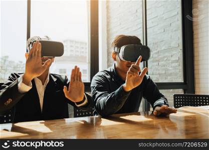 Two business business persons with virtual reality headsets in the office.