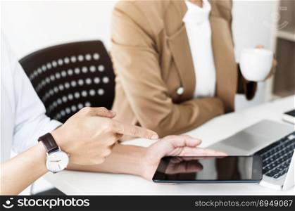 two business executives friendship at a cafe or working space and discussing a project
