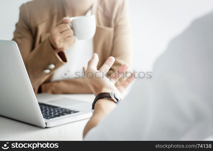 two business executives friendship at a cafe or working space and discussing a project