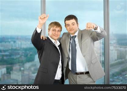 Two business men of colleagues emotionally celebrate a victory