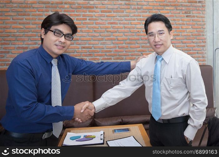 two business men shake hand and discuss together for success and congratulation concept