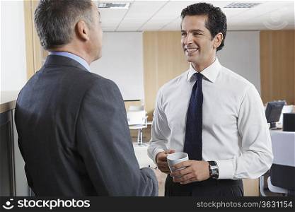 Two business men talking in office