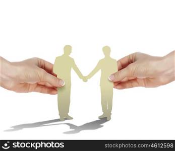 Two business people shaking hands as partners