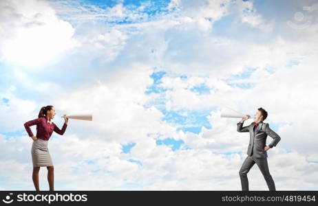 Two business people shouting in megaphones at each other. Business conflict