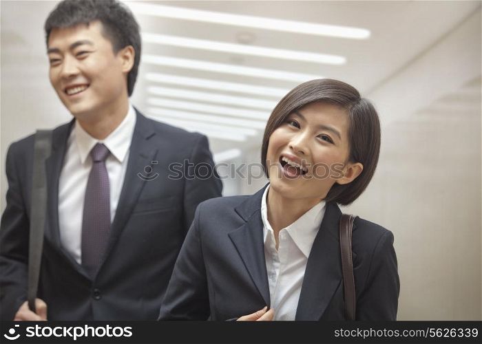 Two Business People Walking Together