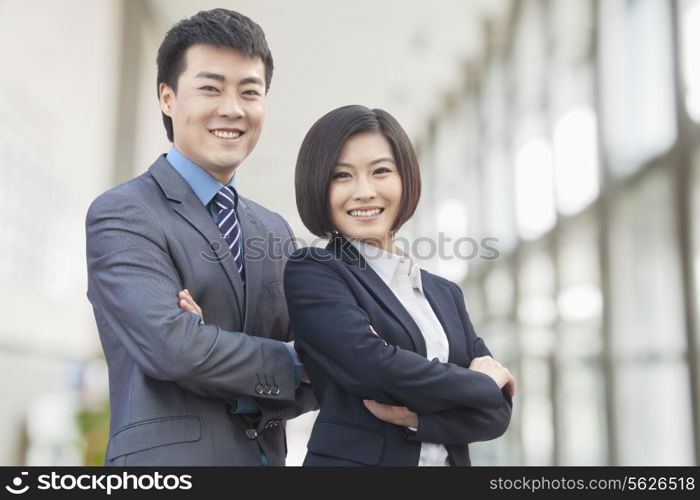 Two Business People with Arms Crossed