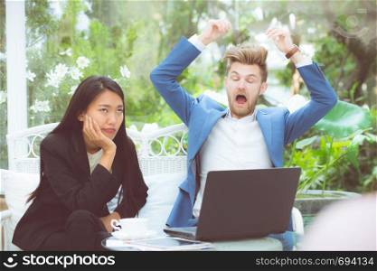 Two business surprised looking at laptop computer with shocked, businessman and businesswoman contract with excited in meeting teamwork.